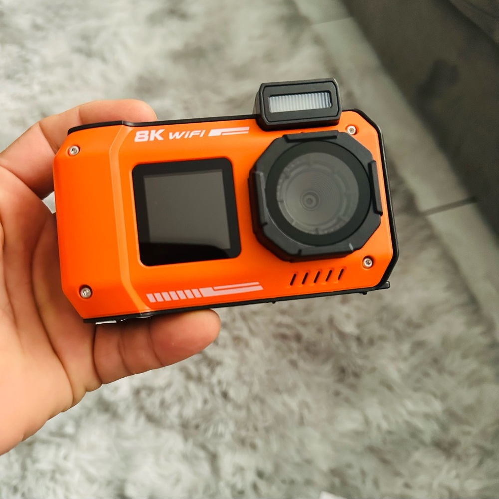 Orange and Black Simulated Camera with Rugged Design